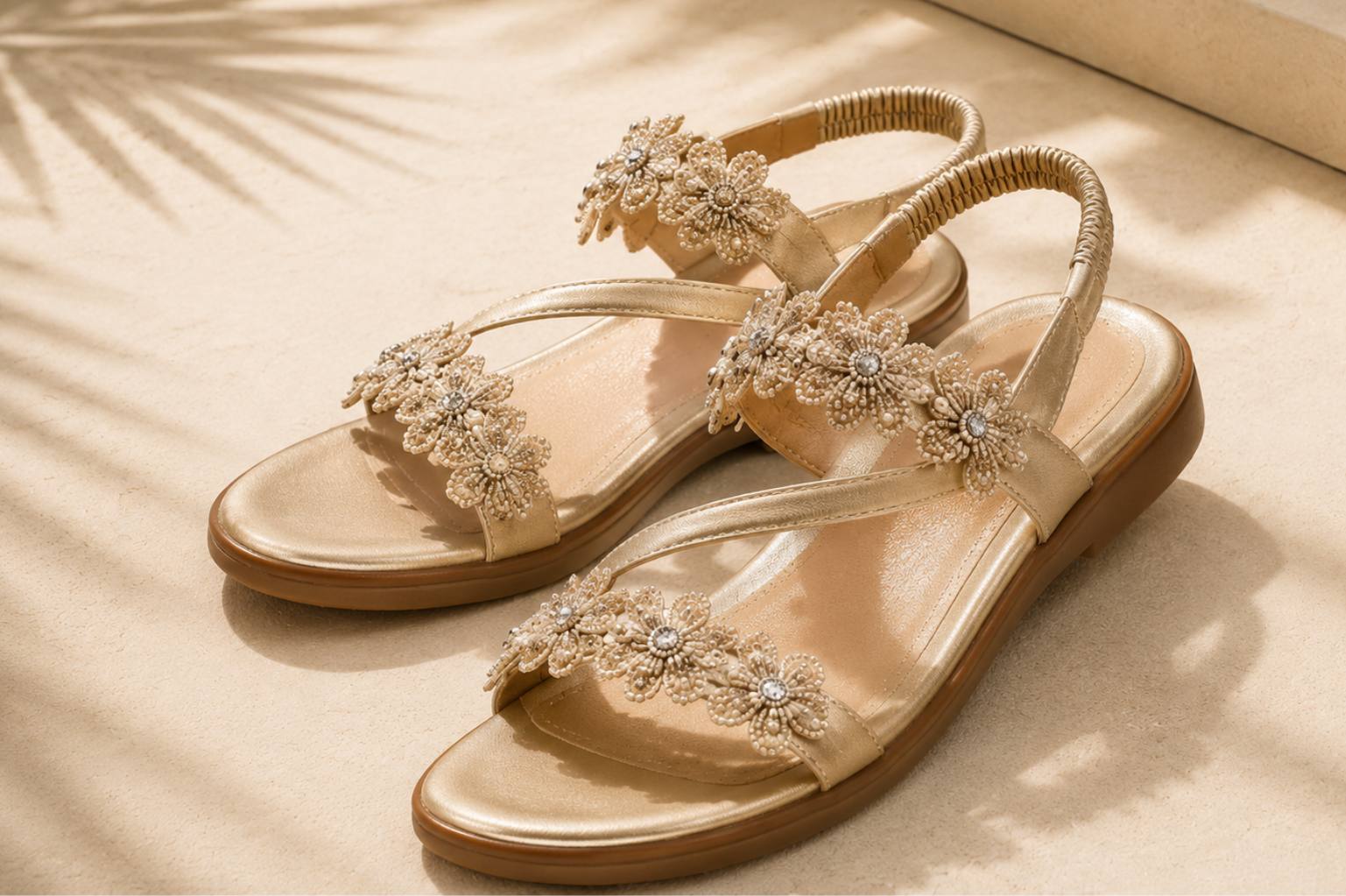 Hand-beaded flat sandal with colorful flower beadwork detail across the strap