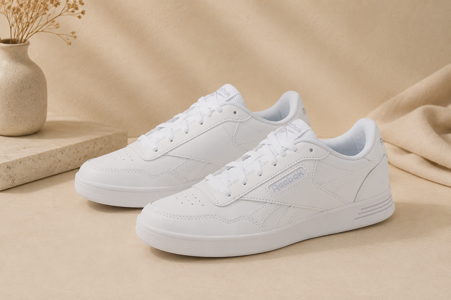 Reebok white casual sneakers styled with denim