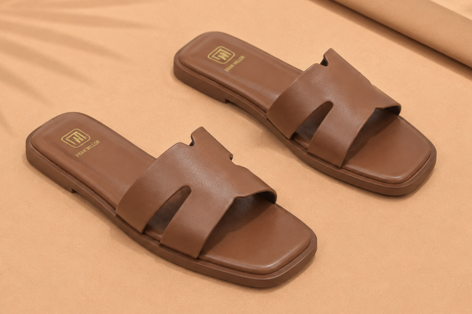 Minimal tan leather-look flat sandal with square open toe, a quiet-luxury summer staple