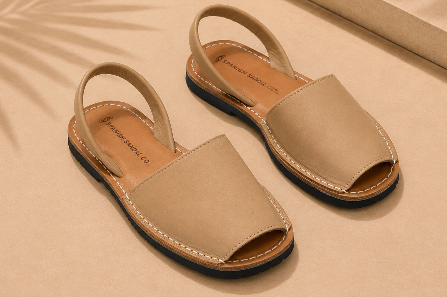 Structured peep-toe flat sandal with a polished, office-appropriate design