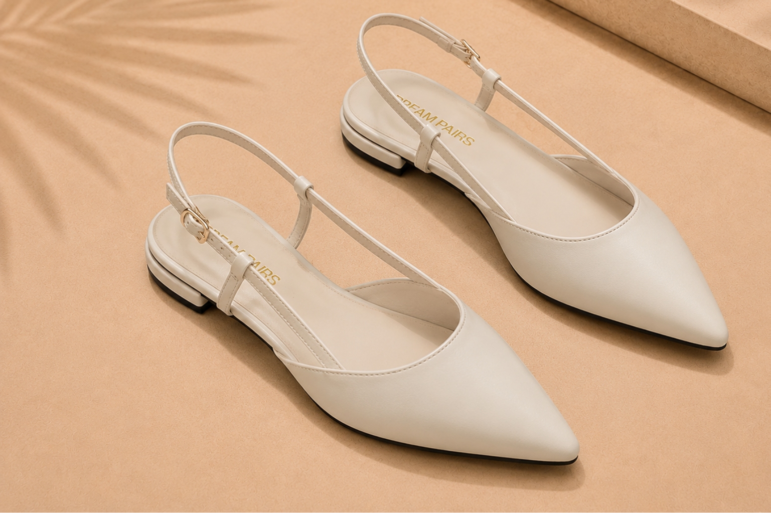 Sleek slingback flat sandal with a thin ankle strap for an elongated leg line